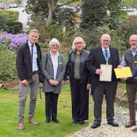 A senior member of a successful garden and home centre dynasty is saluted for his charity work