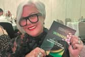 Belong Wigan general manager Gill Menguy with her award.