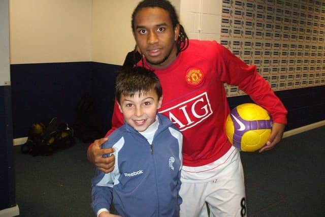 A young Bradley Whittle meets ex-Manchester United player Anderson. Picture: Cavendish Press