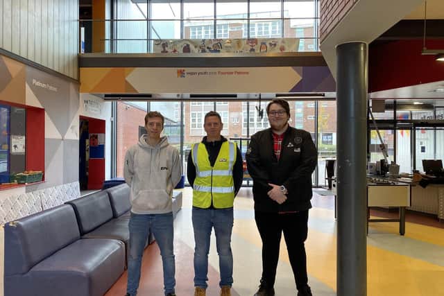 Anthony Smith and Kevin Taylor from ENV Graphics and Signage, with Get a Job student Jack Brown at Youth Zone; youngsters on the Get a Job scheme