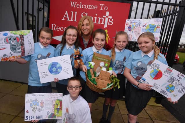 Headteacher Wendy Hughes with Year Six pupils, from left, Erin,11, Lily,11, Jack,11, Mrs Hughes, Seresa, ten, Erin,11, and Lottee, 11, held an assembly about climate change and arranged a non-uniform day and raffle to raise funds for charity after watching the news about the Australian bush fires, at All Saints primary school, Golborne