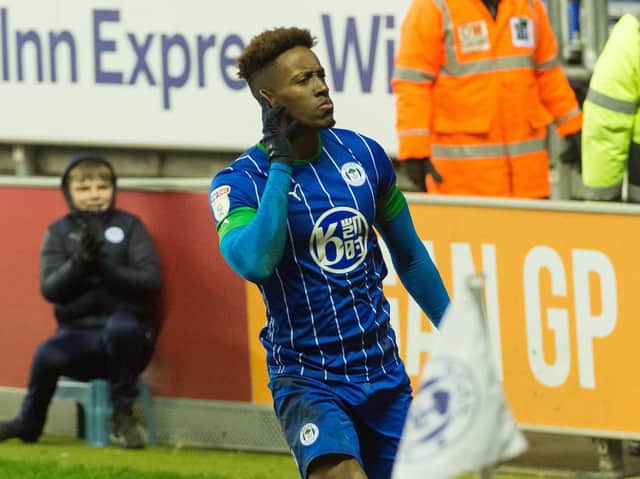 Jamal Lowe wheels away in delight after scoring the winner