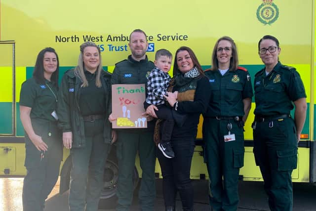 Left to right: Call hander Karen, paramedic Amy, EMT Ian, Mason and Clare Prendergast, paramedics Andrea and Jennifer. The crew saved Mason's life