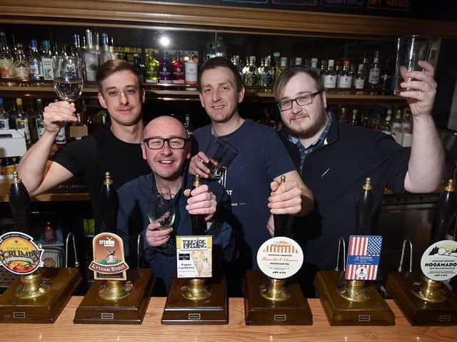 Sean Physick, owners Bob Nelson and Stuart Hurst, and Jim Brown, in the Twisted Vine