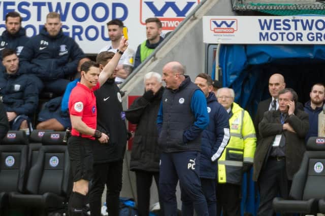 Paul Cook is booked against Preston