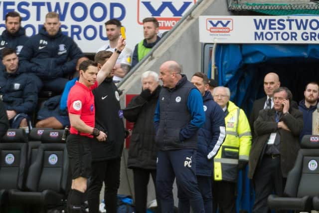 Paul Cook is booked against Preston