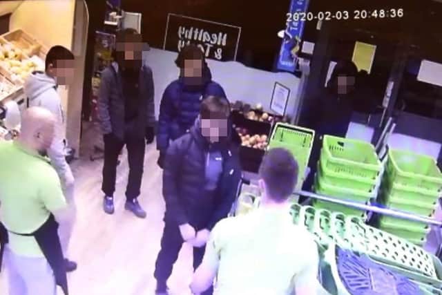 CCTV screen shot - edited to cover identity
Exterior of Food Plus shop, Standishgate, Wigan, staff feel unsafe after being targetted by yobs who have caused damage, shattering glass, shop lifting and threatening staff.