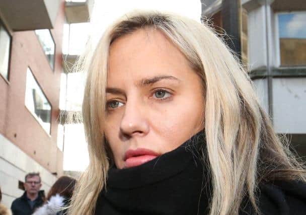 Troubled Caroline Flack leaves Highbury Corner Magistrates' Court where she pleaded not guilty to assaulting boyfriend Lewis Burton