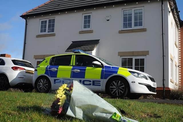 Flowers outside the house in Fleming Court, Shevington, where the jury was told Hollie Ashurst received  fatal injuries. She died a day later when her life support was switched off