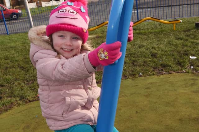 Eloise Bell, four, enjoys the new 60,000 play area on Grange Road, Bryn.