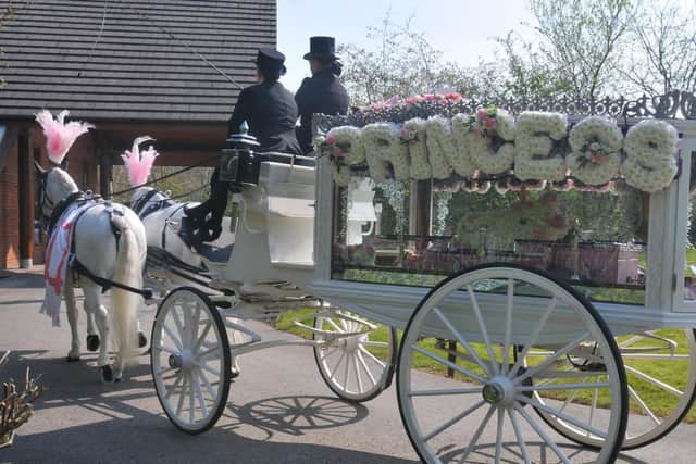 Hollie's coffin was carried in a horse-drawn carriage