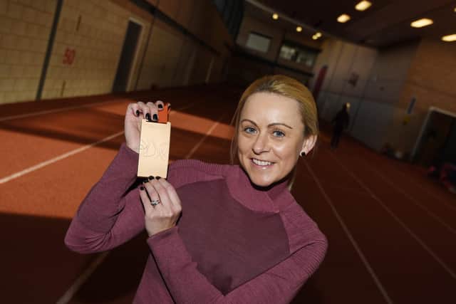 Jenny Meadows with her new medal... from 2009