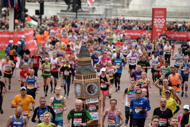Runners compete during the Virgin London Marathon 2019 (Photo by Jeff Spicer/Getty Images)