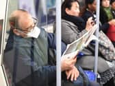A man on an underground train wearing a protective mask