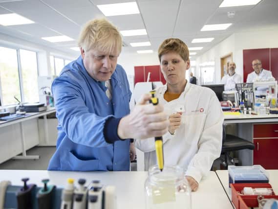 Prime Minister Boris Johnson during a visit to a laboratory in Bedfordshire, where he announced a 46m funding package for developing testing kits in the fight against coronavirus. Pic: Jack Hill/The Times/PA Wire
