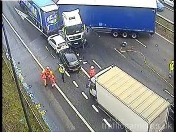 Emergency services are at the scene of a multi-vehicle crash involving a number of lorries near junction 21 of the M6