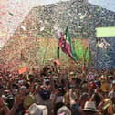Revellers cheer as Australian singer Kylie performs at the Glastonbury Festival in 2019