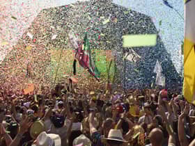 Revellers cheer as Australian singer Kylie performs at the Glastonbury Festival in 2019