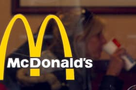 A McDonald's customer is seen through the window at a McDonald's restaurant