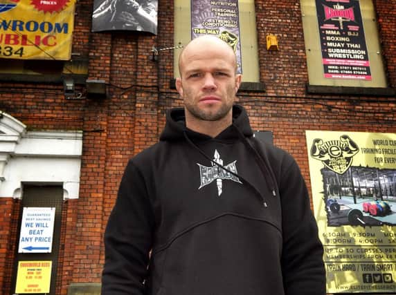 Mike Grundy outside his Wigan gym, Elite Fitness Factory