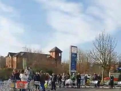 People queuing outside Tesco Extra near Wigan town centre