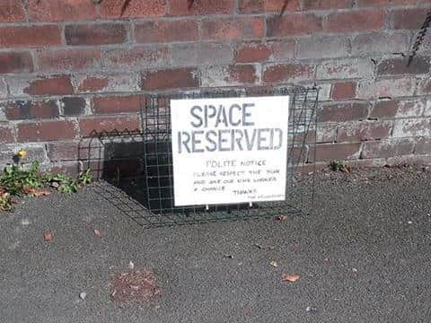 Sign saying the space is reserved