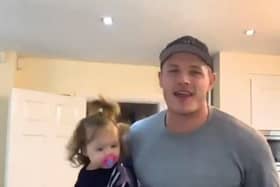George Burgess dances with his daughter in the video