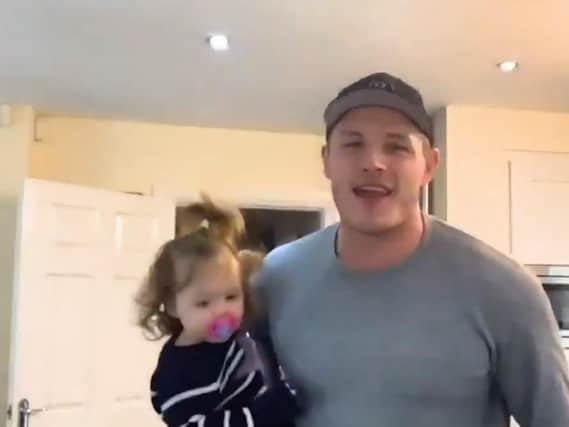 George Burgess dances with his daughter in the video