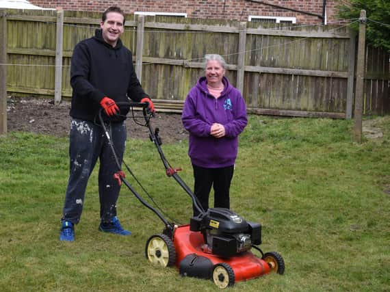 Coun Steve Jones  pictured with Bryn resident Jacqueline Hodson
