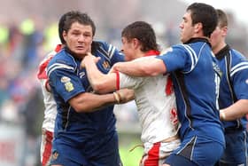 Stephen Wild tries to pin down Jon Wilkin's arms