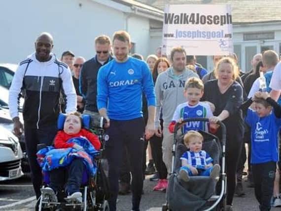 The Joseph's Goal walkers set off for Leeds last April, including Latics legends Emmerson Boyce and Nick Powell