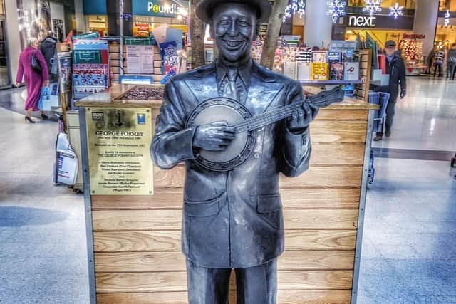 The George Formby statue in the Grand Arcade