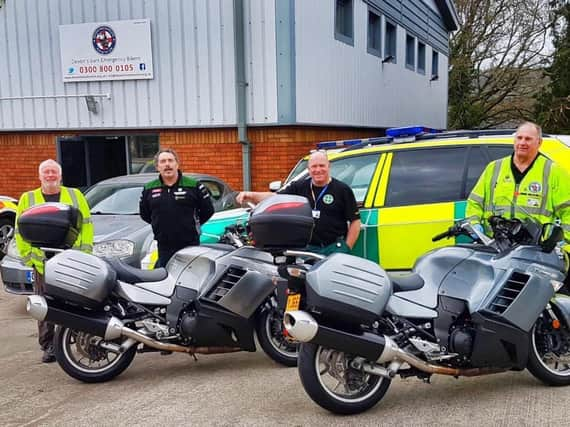 Second left  MCO Service Manager Rod Gaskell delivers the bikes , charity boss Dan Lavery,  second right