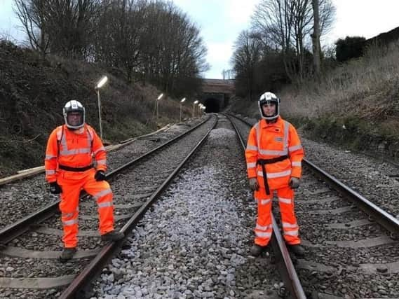 Howerd and Rafael Kernahan who are part of a team that has been laying new track in a 172-year-old tunnel under Up Holland and, below, the new track being installed