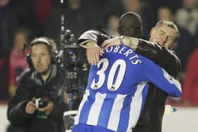 Paul Jewell congratulates Jason Roberts, whose late goal at Arsenal sent Latics to the Carling Cup final in 2005/06 - a popular pick among our 12th Man panel for 'best season ever'