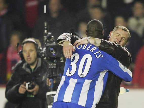 Paul Jewell congratulates Jason Roberts, whose late goal at Arsenal sent Latics to the Carling Cup final in 2005/06 - a popular pick among our 12th Man panel for 'best season ever'