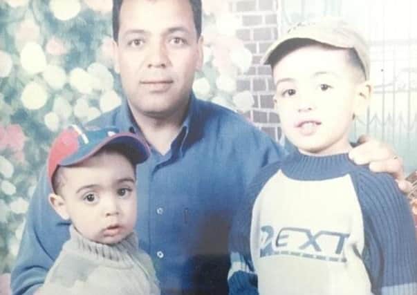 Sadeq Elhowsh with two of his sons