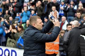 Graeme Jones salutes the Latics crowd before the 0-0 draw last month