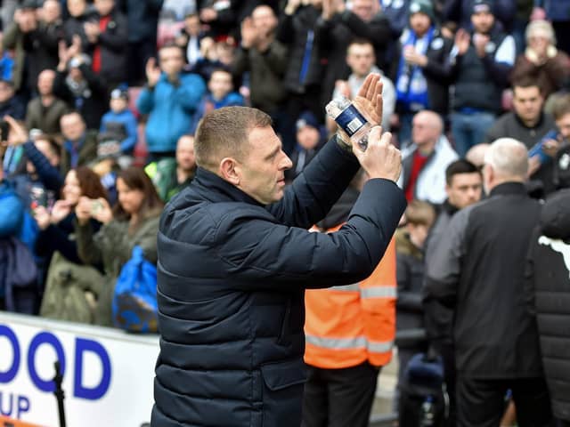 Graeme Jones salutes the Latics crowd before the 0-0 draw last month