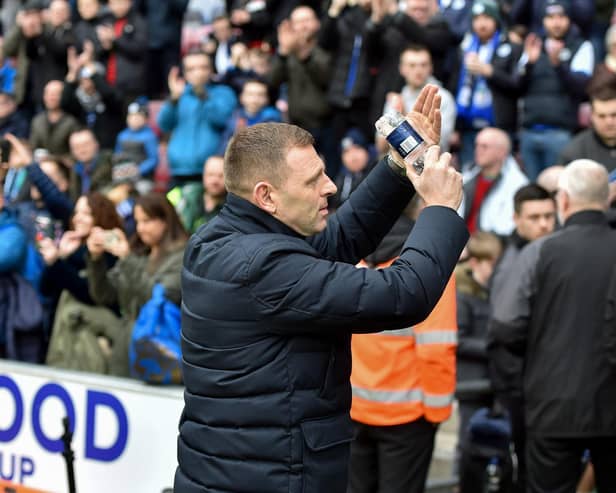 Graeme Jones salutes the Latics crowd before the 0-0 draw last month