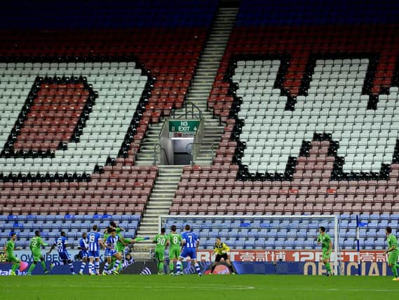 When will football return to the DW Stadium?