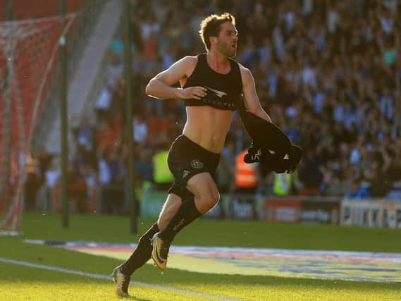 Will Grigg scores the goal at Doncaster that clinched the 2017-18 League One title.