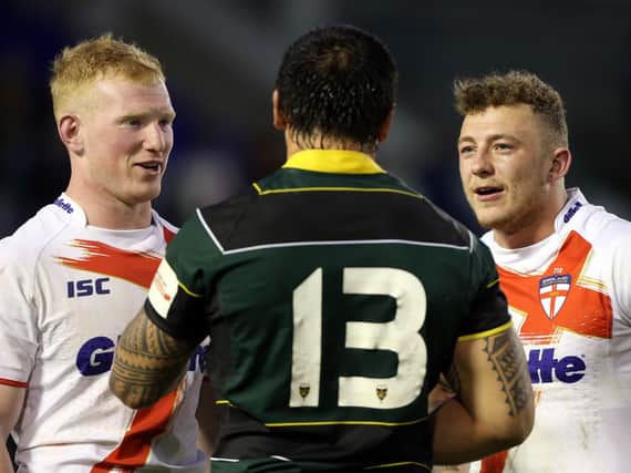 Wigan trio Liam Farrell, Josh Charnley and Harrison Hansen chat after the 2013 Exiles match. Picture: SWPix