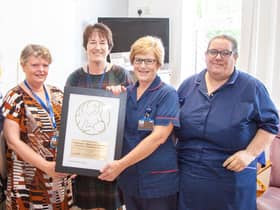 Staff celebrate receiving the award