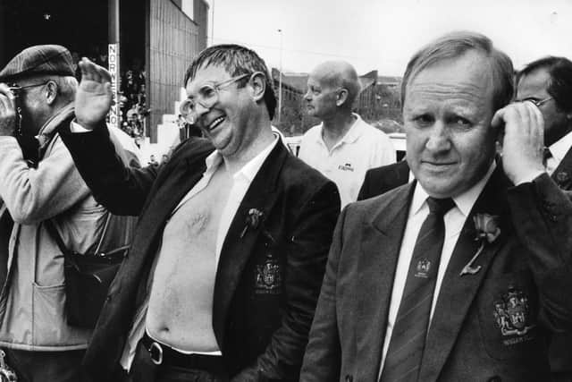 Jack Robinson celebrates a Challenge Cup win, with Maurice Linday (right)