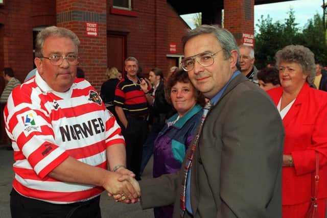 Jack Robinson shakes a fan's hand, towards the end of his tenure