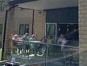 Residents enjoy the concert from their patio