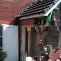 Damage to the porch of the house after the crash