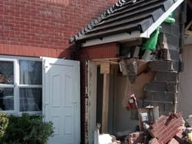 Damage to the porch of the house after the crash
