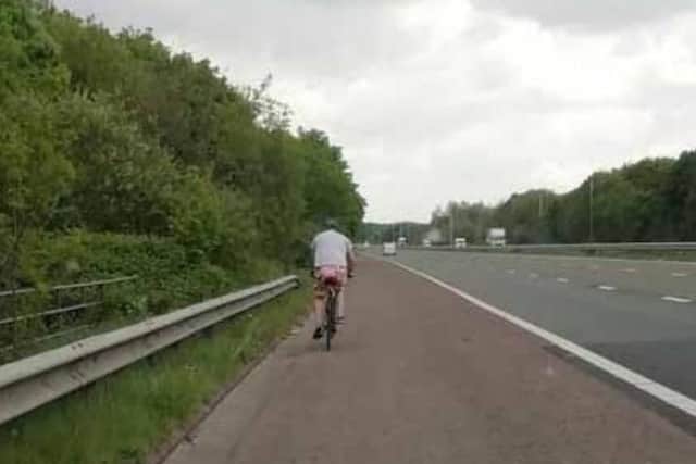 The cyclist on the hard shoulder